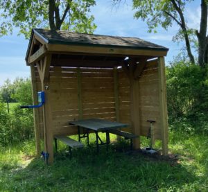 A completed enhanced shelter including the fix it station, bike pump, and hooks in case a stranded bicyclist needed an emergency shelter for the night.
